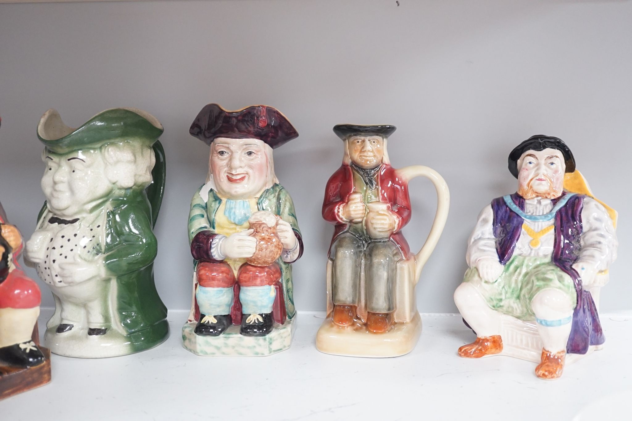 Eleven various pottery Toby jugs- 1 musical